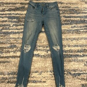 Selling ripped American Eagle Jeans in the color dark blue